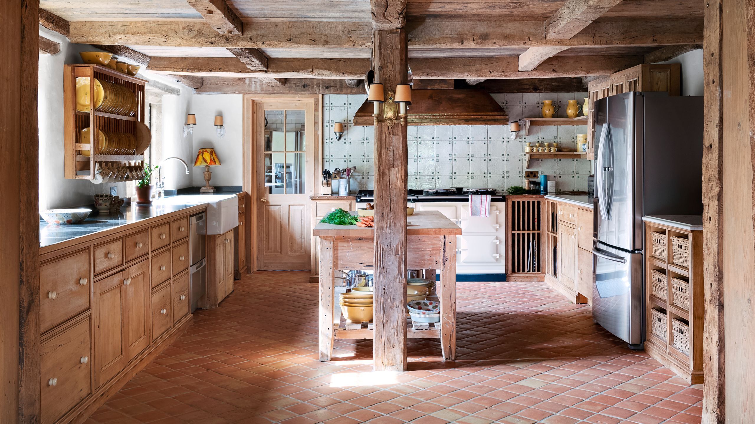 Warm natural wood butcher block countertop adding warmth to a kitchen space