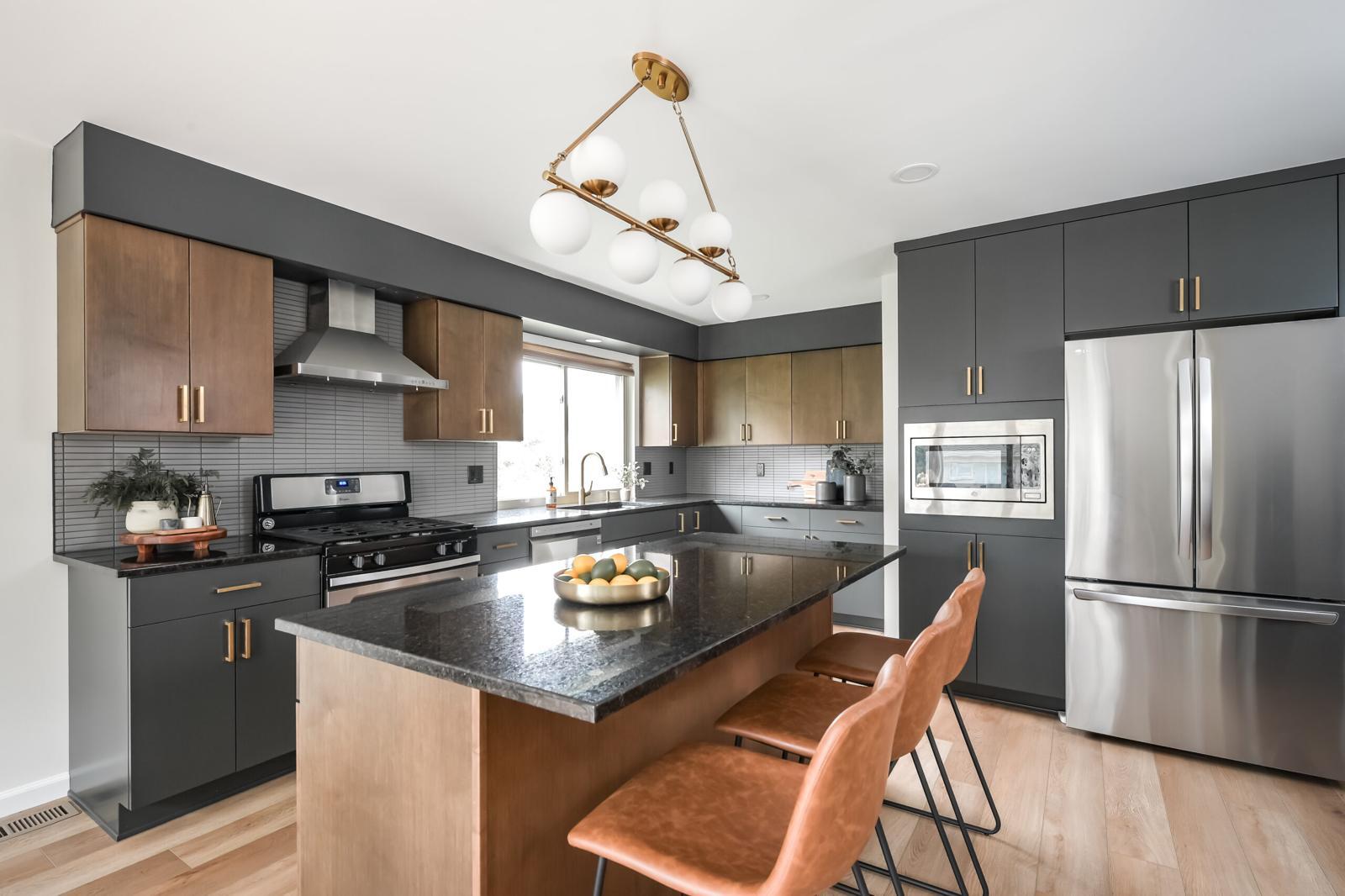 Luxury high-end kitchen with custom cabinetry, premium stone, and professional appliances