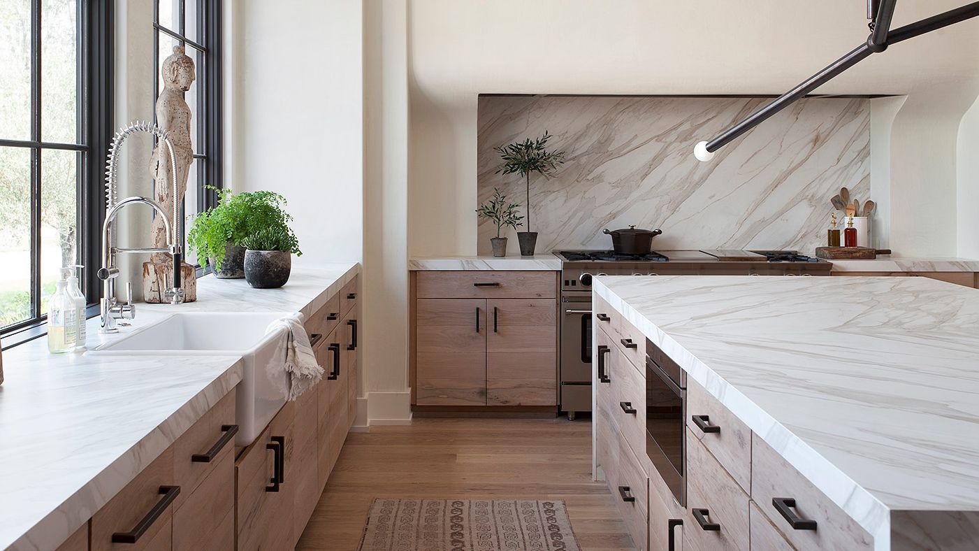 Beautiful mid-range kitchen remodel with new cabinets, quartz countertops, and tile backsplash